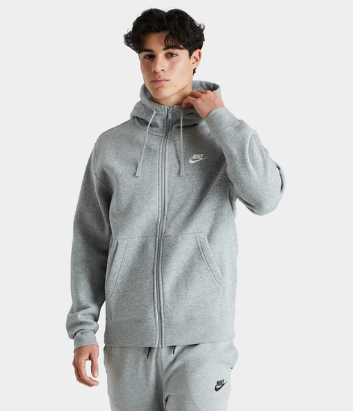 A man wearing a grey nike outfit from JD sports
