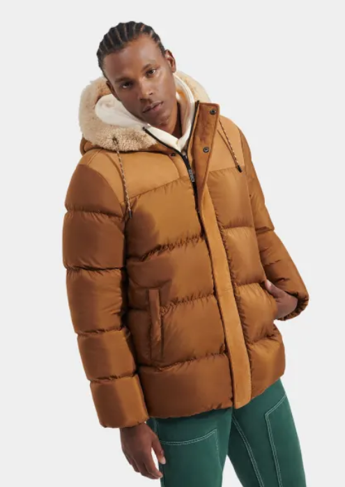 A man wearing a brown puffy jacket