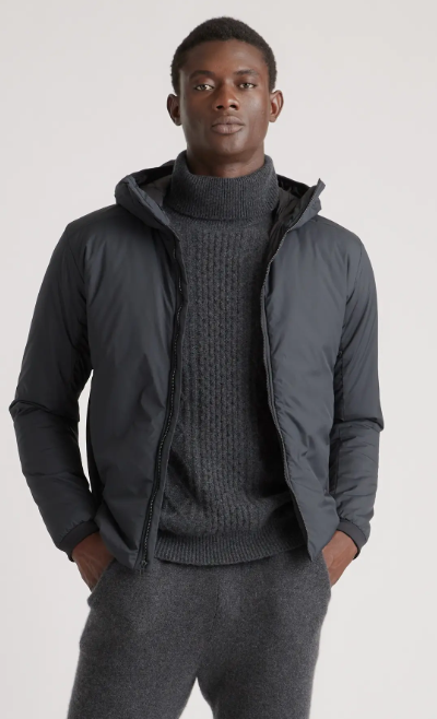 A man wearing a QUINCE turtle neck and jacket in dark grey