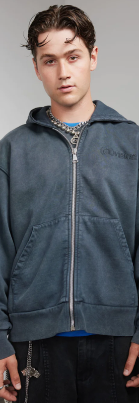 A man wearing a zip hoody by (DI)VISION