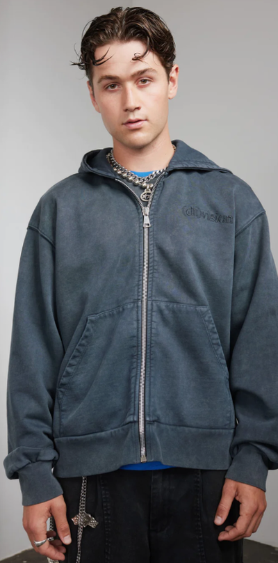 A man wearing a zip hoody by (DI)VISION