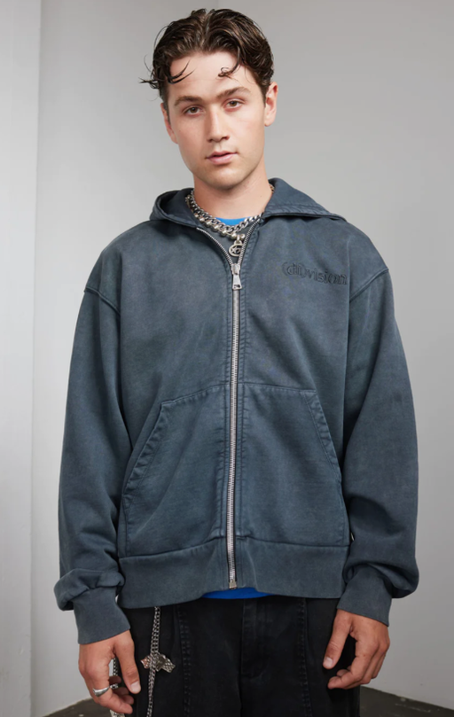 A man wearing a zip hoody by (DI)VISION