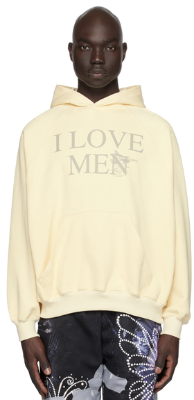 A man wearing a 'I Love Men' Praying hoodie and colorful butterfly pants