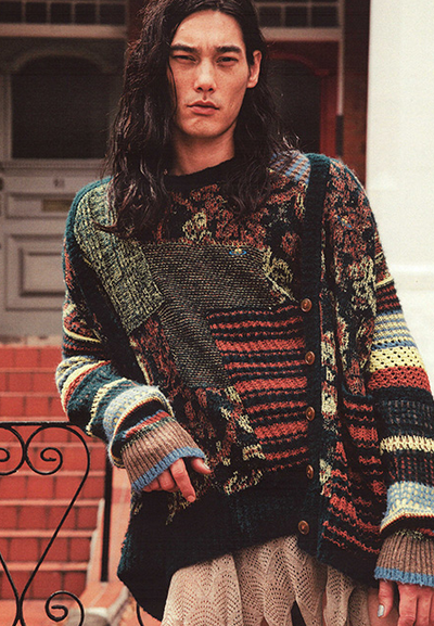 A man wearing a colorful Vivenne Westwood sweater
