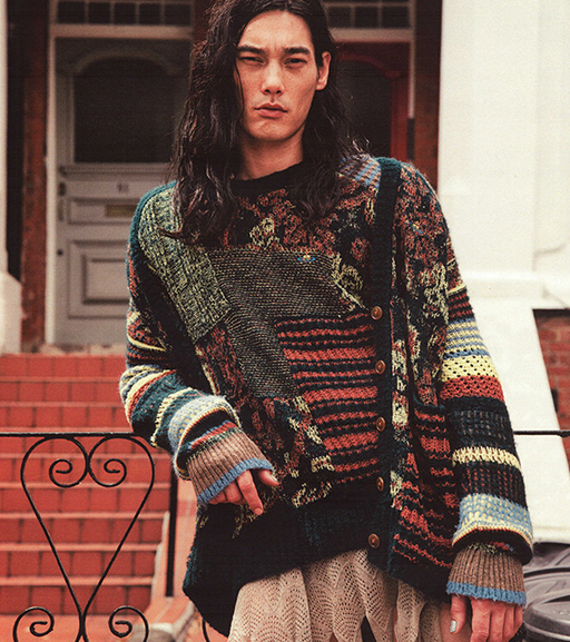A man wearing a colorful Vivenne Westwood sweater
