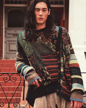A man wearing a colorful Vivenne Westwood sweater
