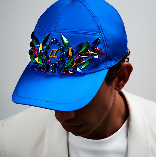 A man wearing a blue colorful Christian Louboutin