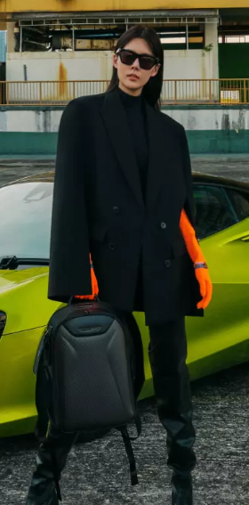 A woman wearing a Tumi formal outfit with red flares