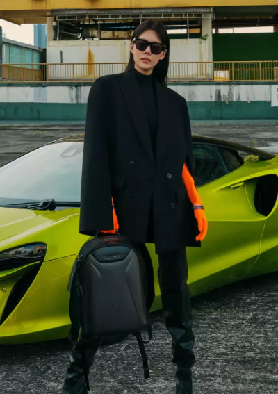 A woman wearing a Tumi formal outfit with red flares