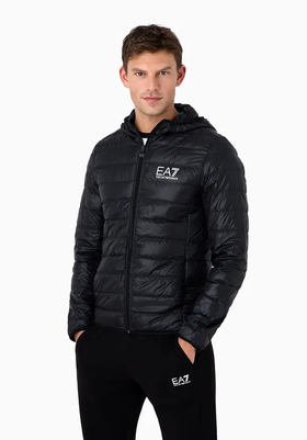 A man wearing an emporio armani light green leath jacket with black pants