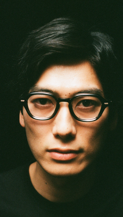 A man wearing a pair of Yuichi Toyama black eyeglasses