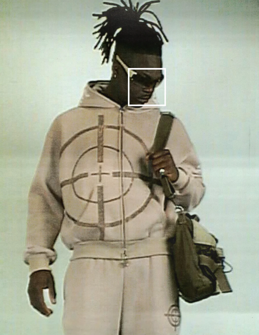 A man wearing a bullseye light brown Named Collective hoodie