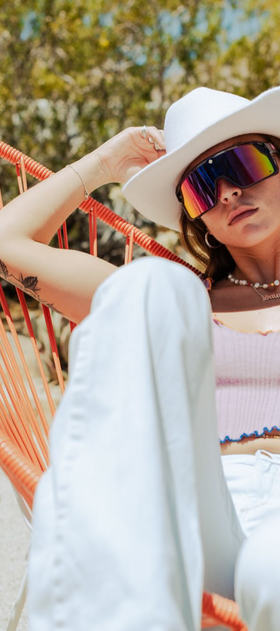A woman wearing a pair of Spy Optic sunglasses