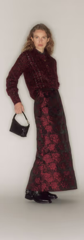 A woman wearing a GANNI outfit