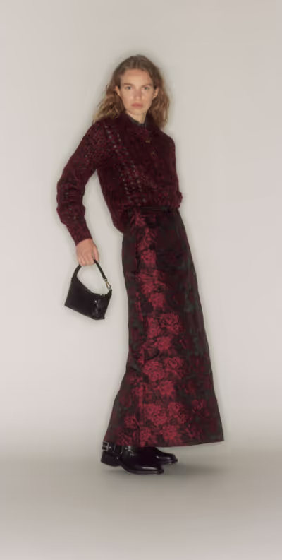 A woman wearing a GANNI outfit