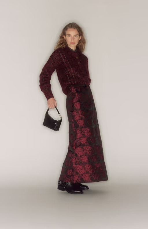 A woman wearing a GANNI outfit