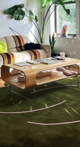 A blue Okej Rug in an apartment