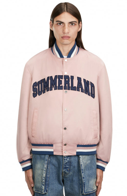 A man wearing a Nahmias Summerland jacket in pink
