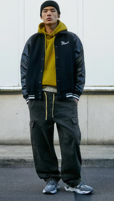 A man wearing a Pull & Bear sweatsuit and hoodie