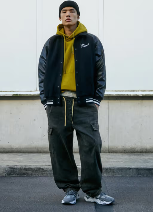 A man wearing a Pull & Bear sweatsuit and hoodie