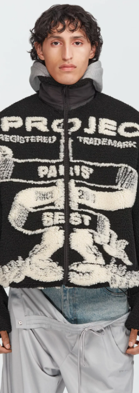 A man wearing a Y/Project graphic-forward jacket