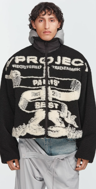A man wearing a Y/Project graphic-forward jacket