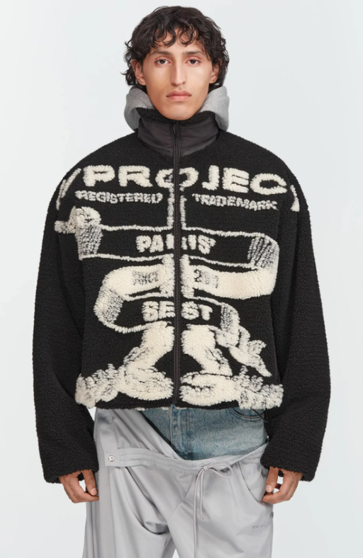 A man wearing a Y/Project graphic-forward jacket