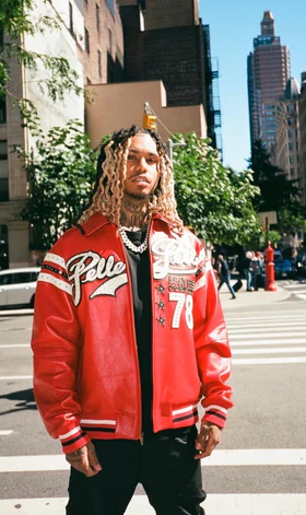 A man wearing a red Pelle Pelle jacket