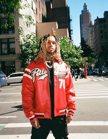 A man wearing a red Pelle Pelle jacket