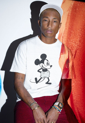 Pharrel wearing a Richard Mille watch and a mickey mouse t-shirt