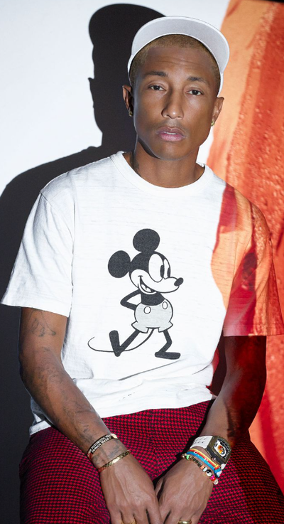 Pharrel wearing a Richard Mille watch and a mickey mouse t-shirt