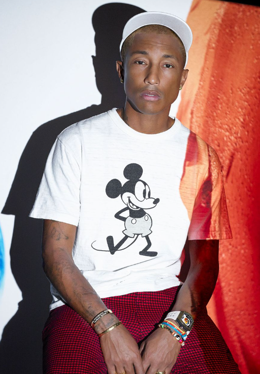 Pharrel wearing a Richard Mille watch and a mickey mouse t-shirt