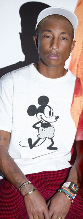 Pharrel wearing a Richard Mille watch and a mickey mouse t-shirt
