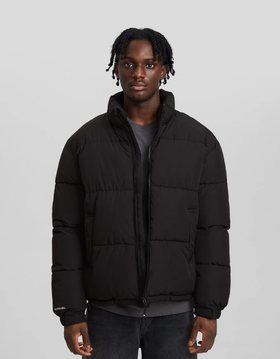 A man wearing a Bershka black jacket