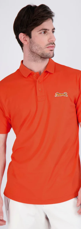 A man wearing a red Le Tigre polo shirt