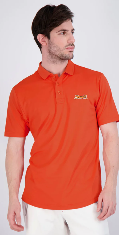 A man wearing a red Le Tigre polo shirt