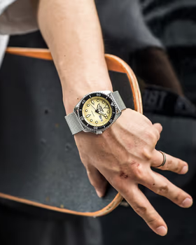 A man wearing a silver Seiko