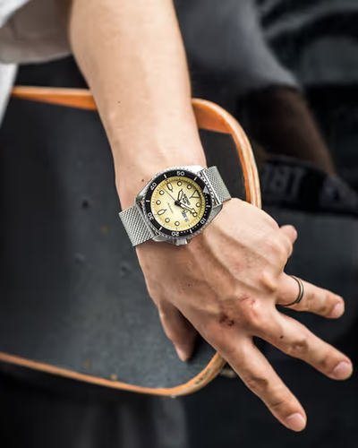 A man wearing a silver Seiko