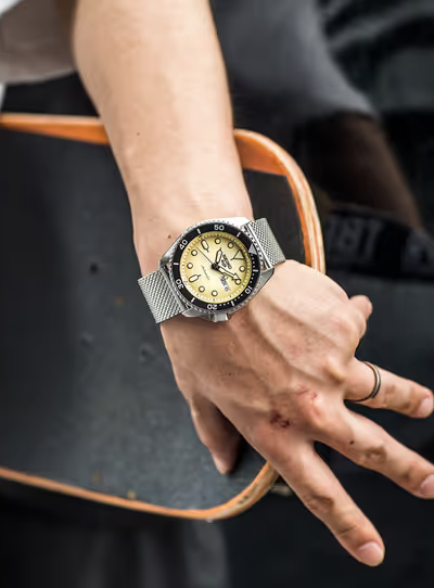 A man wearing a silver Seiko