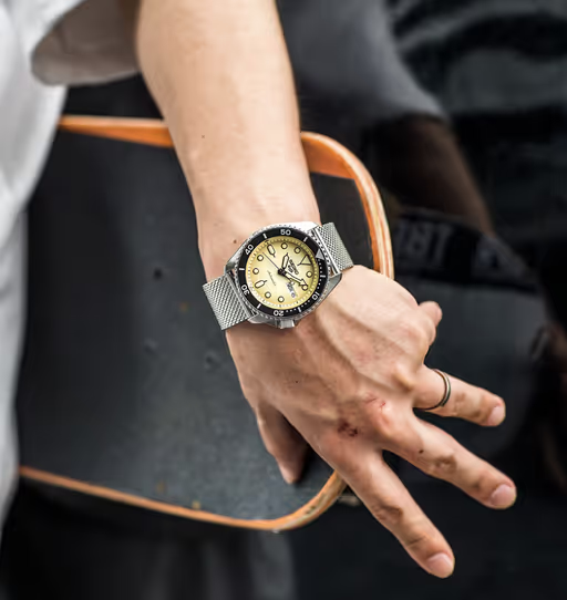 A man wearing a silver Seiko