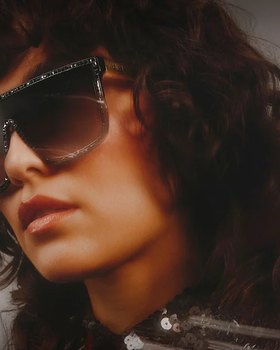 A woman wearing a pair of Quay Australia sunglasses