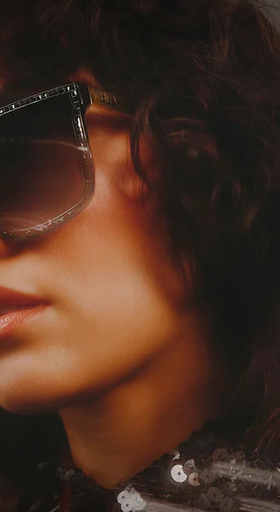A woman wearing a pair of Quay Australia sunglasses