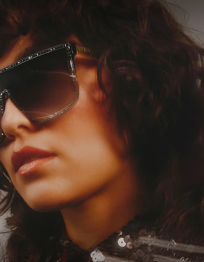 A woman wearing a pair of Quay Australia sunglasses