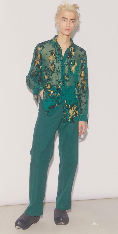 A man wearing a green Sies Marjan outfit