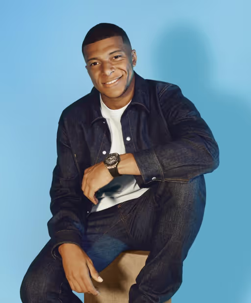 A man wearing a Hublot watch and a black shirt