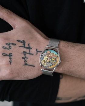 A man wearing a colorful Mr Jones silver watch