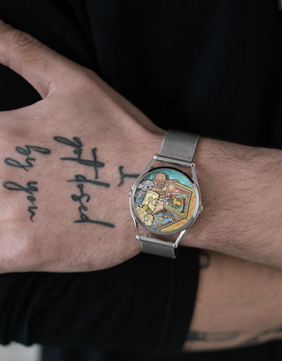 A man wearing a colorful Mr Jones silver watch