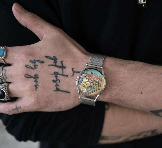A man wearing a colorful Mr Jones silver watch