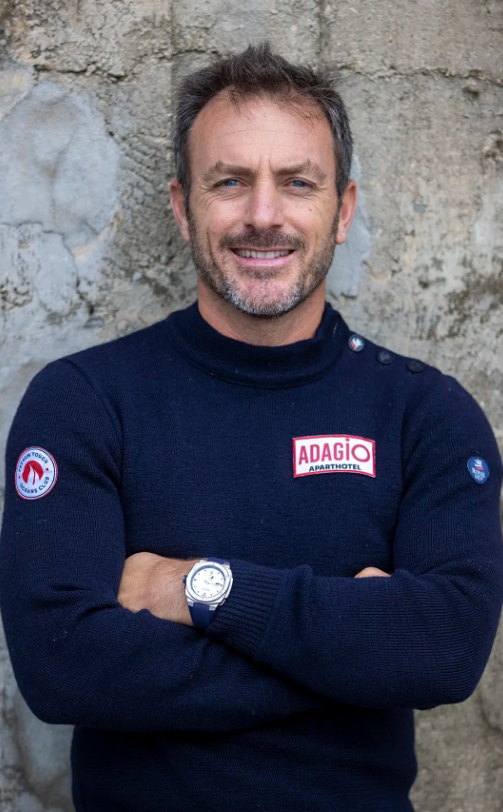 A man wearing an Alpina silver watch