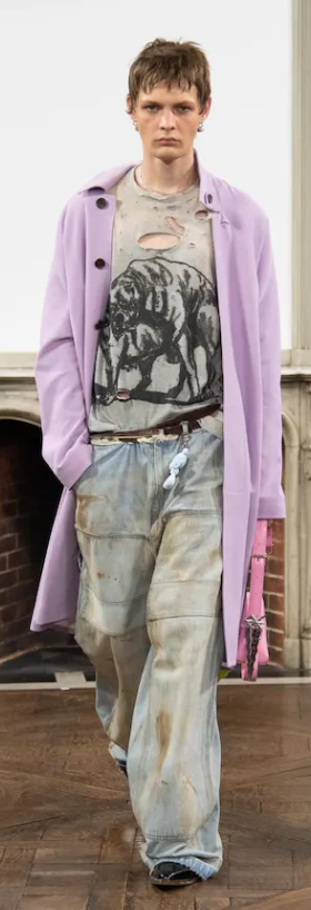 A man wearing a Sankuanz outfit in violet and jeans